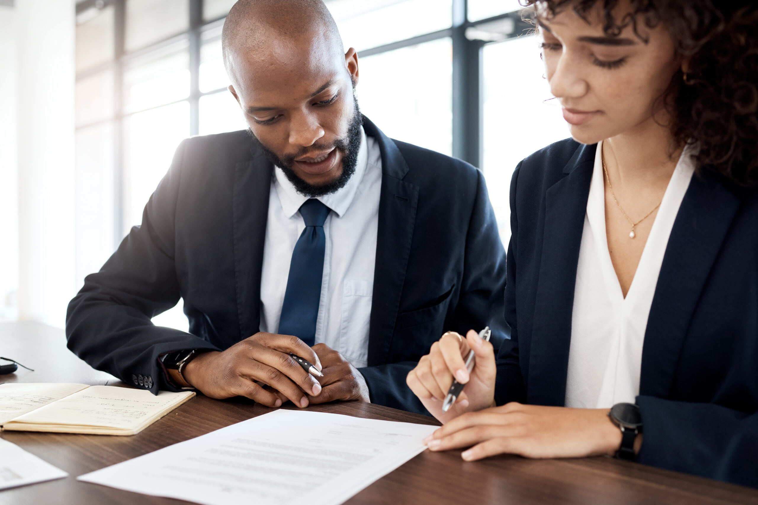 Documents, business team and black people reading notes for accounting strategy, planning and company